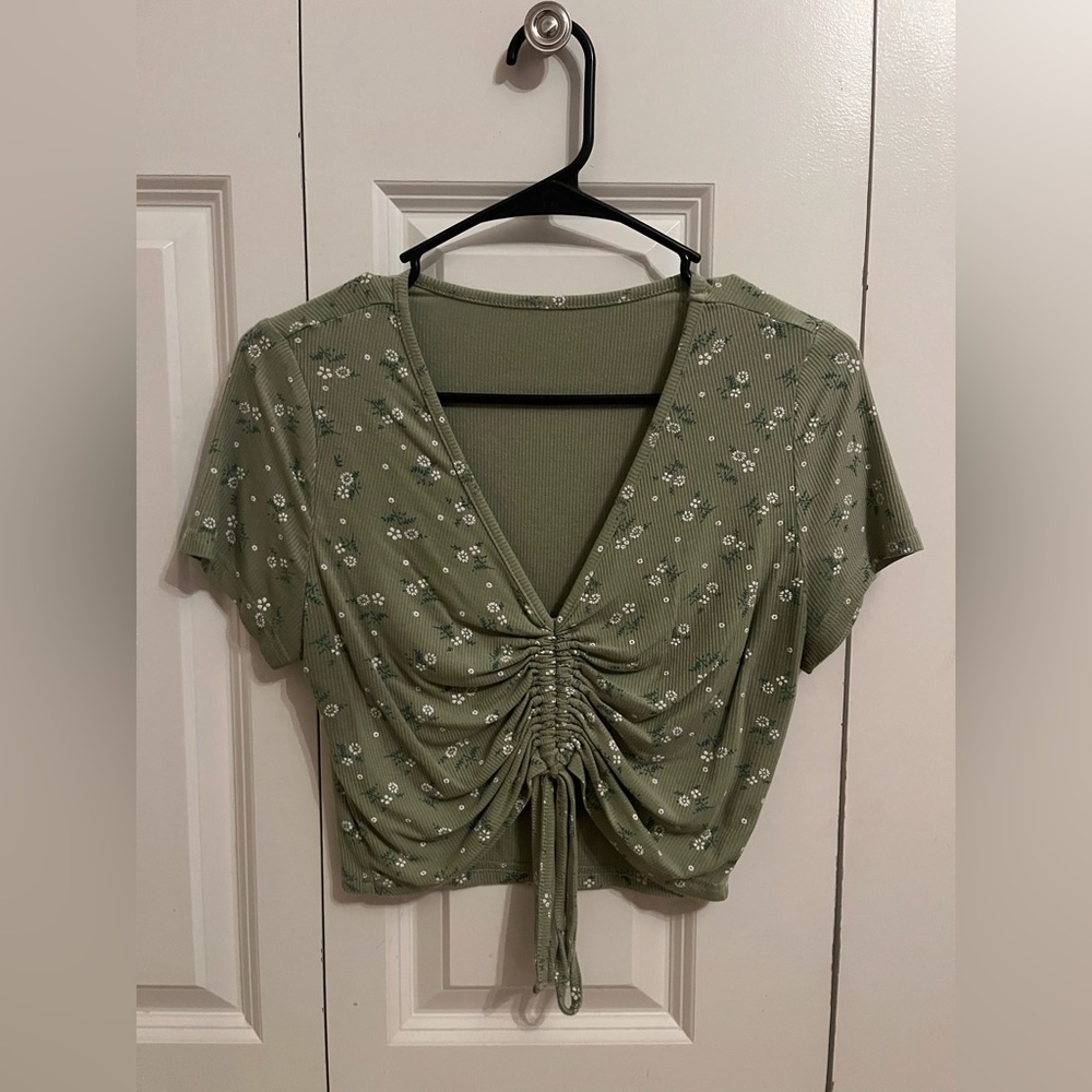 green floral draw string shirt, dry fit material, stretchy, super comfy